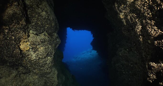 cave diving underwater with nice blue color of ocean