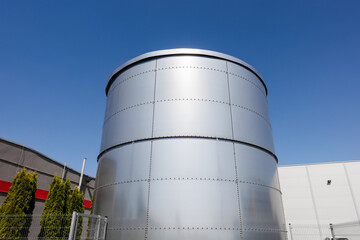 Wide Angle Shot of Industrial Steel Silo at Modern Factory Complex. Manufacturing and Storage Infrastructure in Gniezno Poland