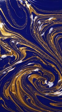 Continuous slow flowing abstract wave pattern of viscous blue and shimmering gold liquid forming beautiful repetitive swirls and eddies creativity, background, dynamic
