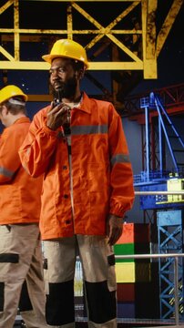 Vertical Video Green and blue screen on devices support offshore drilling rig calibration and logistics through automation software. Improving petroleum extraction in the oil and gas industry.