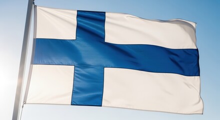 Finland independence day celebration with finnish flag waving in blue sky