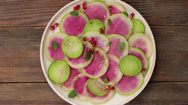 watermelon radish daikon salad on plate food top zoom.