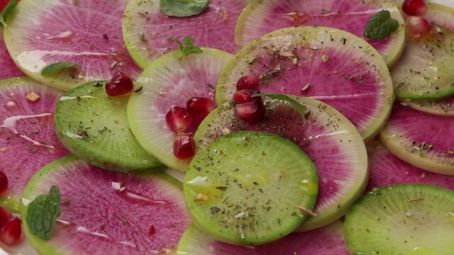 watermelon radish daikon salad on white plate food