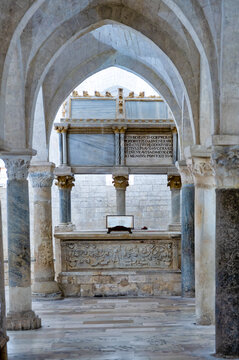 Interior view of the Romanesque crypt of the Osimo Cathedral with the marble arca of Saint Benvenuto Scotivoli and medieval stone columns