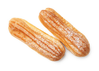 Tasty eclairs with powdered sugar isolated on white, top view