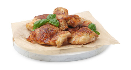 Tasty roasted chicken thighs with basil isolated on white