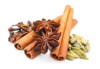 Mulled wine spices. Cinnamon sticks, anise stars, cardamon seeds and cloves isolated on white
