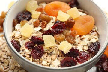 Making granola. Oat flakes, dried fruits and other ingredients on table, closeup