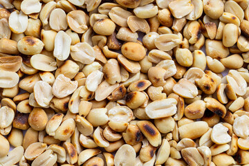 Close-up macro of roasted peanuts,Close up of roasted peanuts background,Roasted and salted peanuts, snack food, background, from above 