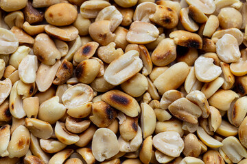 Close-up macro of roasted peanuts,Close up of roasted peanuts background,Roasted and salted peanuts, snack food, background, from above 