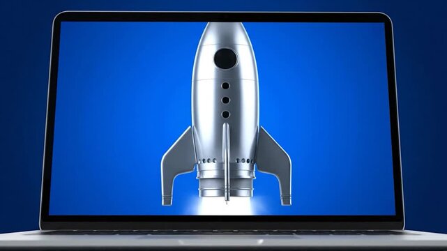 A silver rocket ship is displayed on a laptop screen against a vibrant blue backdrop