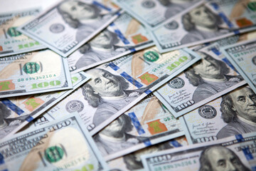 Group of money stack of one hundred US dollars banknotes a lot of the background. Top view.