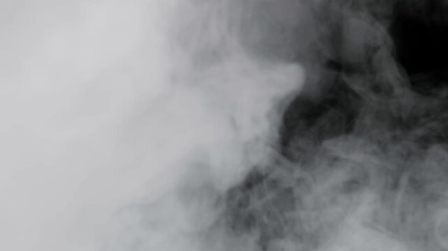 4K VFX Element practical atmospheric smoke. Abstract dense haze mist smoke cloud. Smoke in slow-motion floating through space against black. Mist effect. Fog effect. Haze and vapor action element.