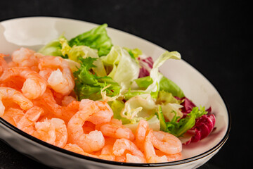 Shrimp salad seafood appetizer tasty snack fresh gourmet food background on table rustic food top view copy space pescetarian diet