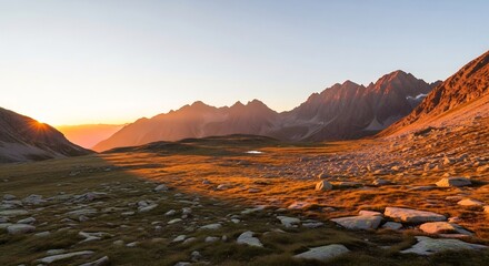 Golden Hour Illuminates a Rugged Mountain Valley Landscape.