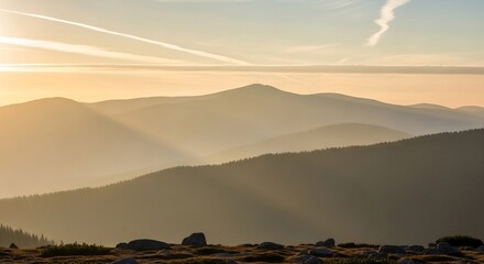 Golden Hour Serenity - Layers of Mountains Under a Hazy Sky.