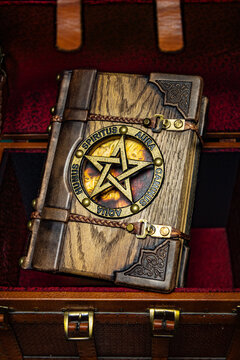 old wooden-leather book with a pentagram 