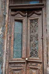 Weathered abandoned doorway shows rustic wood