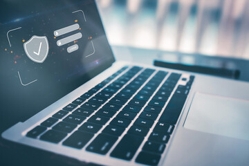 Laptop displaying a login screen with username/password fields, symbolizing cyber security and data protection.