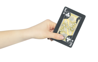 playing card clubs king in hand, outstretched hand with black playing card isolated from background