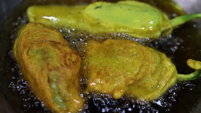 Mirchi vada or mirchi pakoda deep fried chili filled with spicy potato