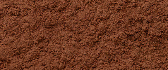 Fine cocoa powder texture in rich brown color creating a natural culinary background ideal for dessert design, baking concepts and product packaging visuals