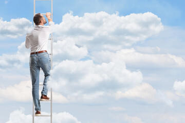 Rear view shot of a man climbing a ladder © Ljupco Smokovski