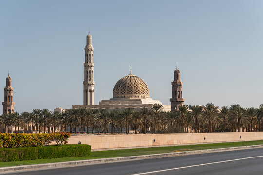 Sultan Qaboos Grand Mosque surrounded by palm trees