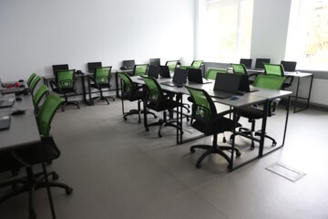 Computer science class with laptops at school