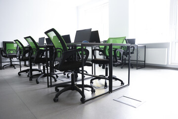 Computer science class with laptops at school