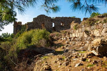 Obraz premium The ancient city of Syedra has located about 20 km. southeast of Alanya district of Antalya, on a mountainous area just west of the small coastal plain fed by the Sedre Stream. The city has developed 