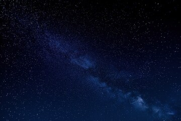 Expansive starry night sky with the Milky Way galaxy, a vast universe filled with scattered stars under a dark blue cosmos, for astronomy and science concepts.