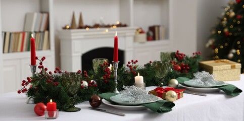 Festive table setting with Christmas decor and burning candles indoors, closeup