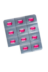 Isolated blister pack of bright pink pills