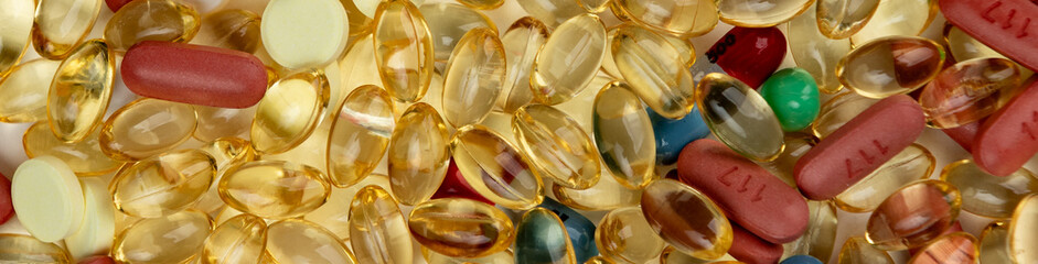 Macro close up of a lot of pain pills and supplements