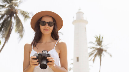 Happy Female Traveler With Camera At Galle Lighthouse Sri Lanka