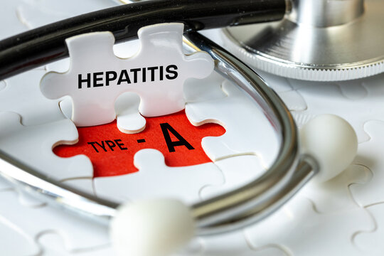 Hepatitis type A virus. Infectious disease, Health concept. Written Hepatitis A on a puzzle, Cause and effect. Stethoscope. Close up.