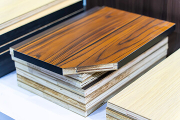 Decorative wood tile plywood in different colors. Decorating the walls.