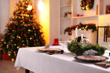 Festive table setting with Christmas decor indoors. Space for text
