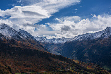 Fototapeta premium Panoramic view of the Swiss Alps near the municipality of Andermatt in autumn.
