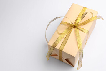 Beautiful gift box on white background, closeup. Space for text