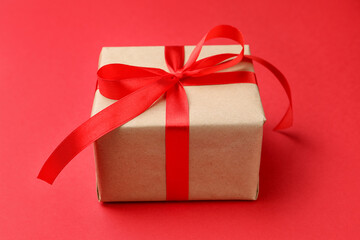 Beautiful gift box on red background, closeup