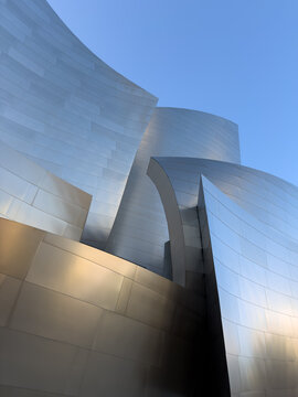 LOS ANGELES, CA, OCT 1, 2025: Dramatic sculptural metallic forms of Walt Disney Concert Hall twist and overlap, creating bold architectural statement with interplay of light, shadow, and curves