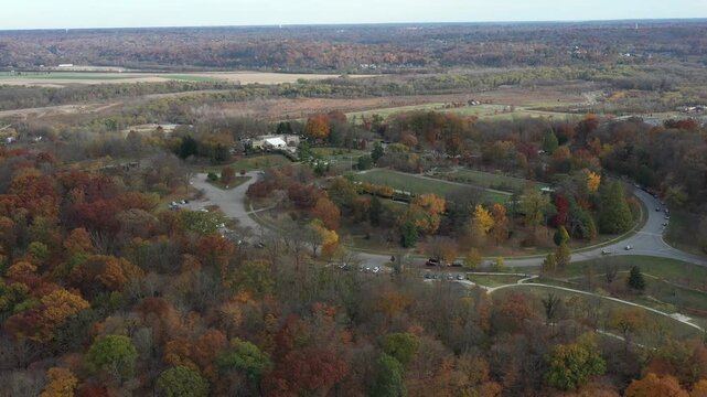 Aerial view of Ault Park showing the colorful fall foliage, winding roads, parking lots, and buildings, Cincinnati, Ohio, United States.