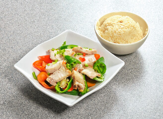 Enjoy this flavorful pork belly stir-fry with colorful bell peppers and rice. A delicious, healthy, and balanced meal, perfect for a quick and tasty dinner.