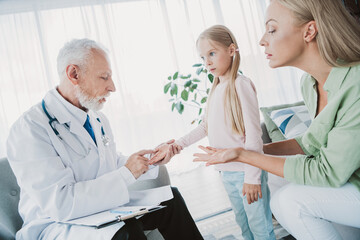 Fototapeta premium Funny caring doctor visit at home brings family together a warm check up moment