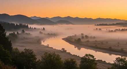 Obraz premium Serene River Valley Landscape at Sunrise with Misty Mountains and Lush Green Forests
