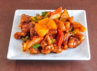 Indulge in the delicious sweet and sour chicken, a vibrant dish with juicy pineapple and bell peppers. Perfect for a quick takeout or gourmet restaurant meal.