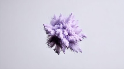 A vibrant explosion of purple powder against a light background.