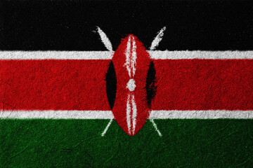 Textured image depicting the flag of Kenya, featuring horizontal bands of black, red, and green, separated by white stripes, and a central Maasai shield and spears, evoking national
